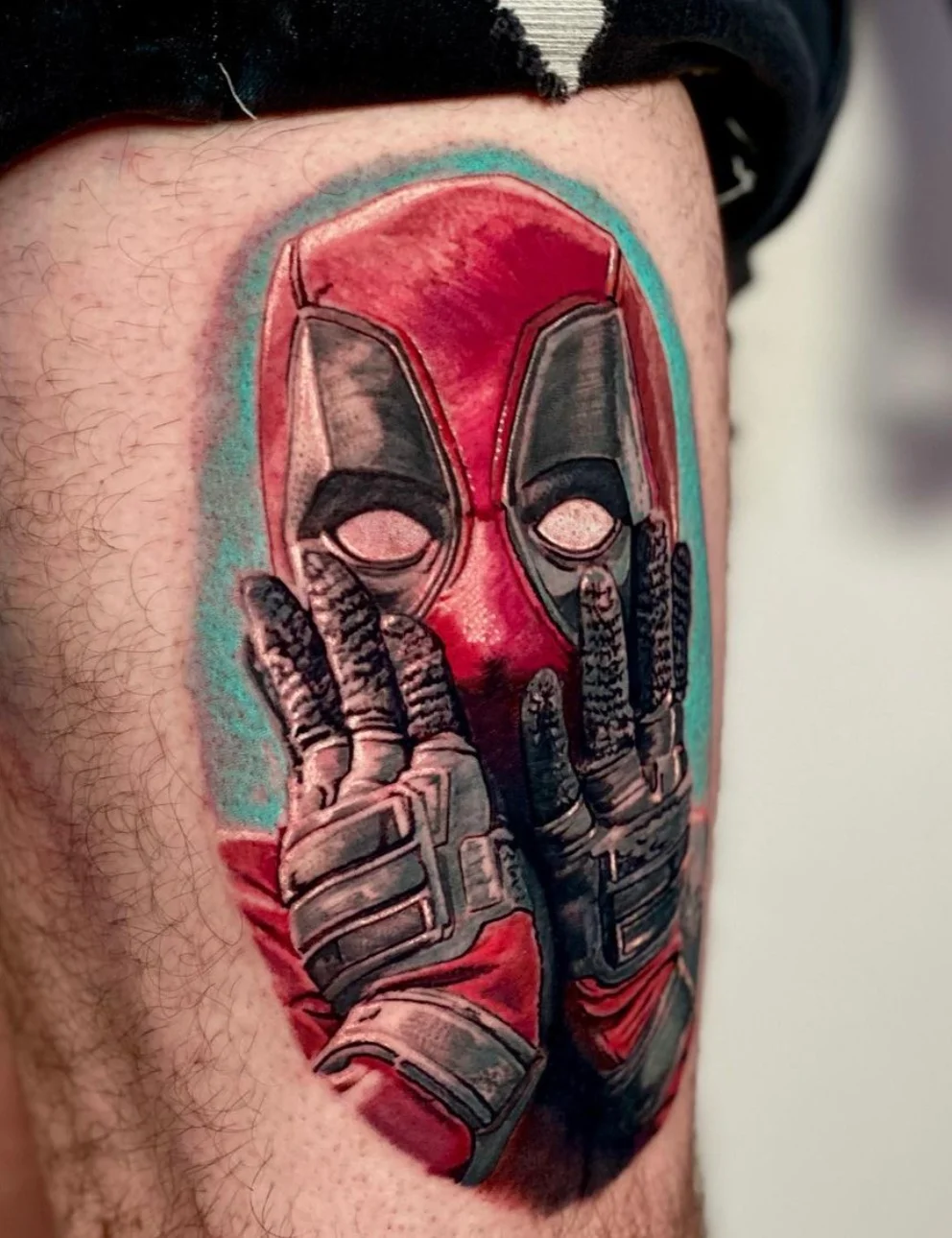 Deadpool comic character tattoo with vibrant red details by Karlo at Omnia Tattoo Melbourne