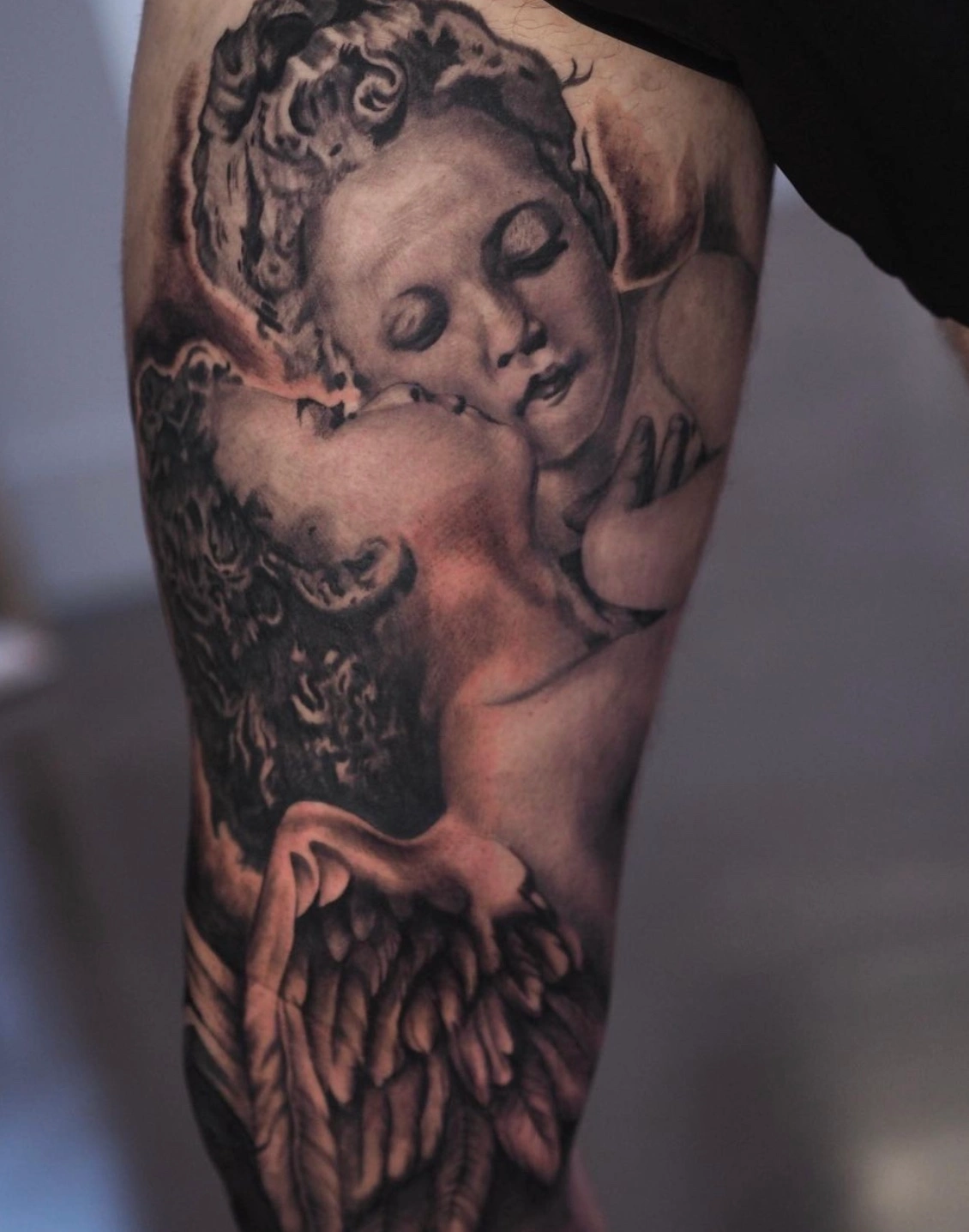 Angel leg inner piece detailed tattoo by Dylan James