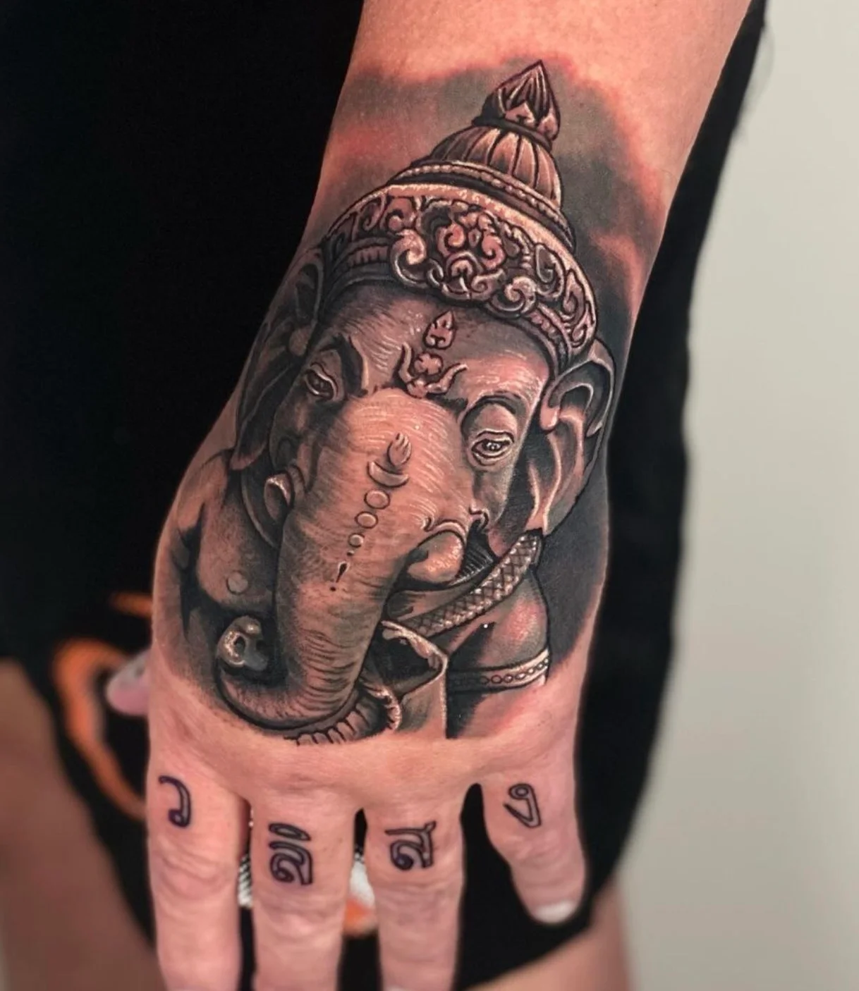 Ganesh hand tattoo with detailed Hindu deity elements and symbolism by Karlo at Omnia Tattoo Melbourne