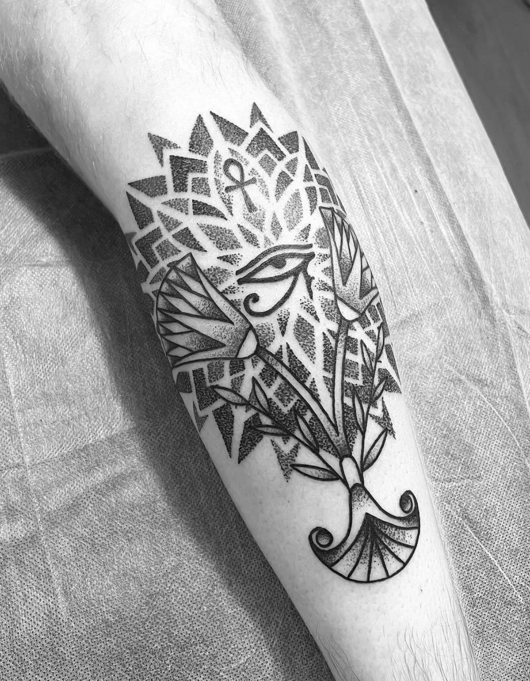 Chest and shoulders geometric tattoo with dotwork technique by Alex Berin