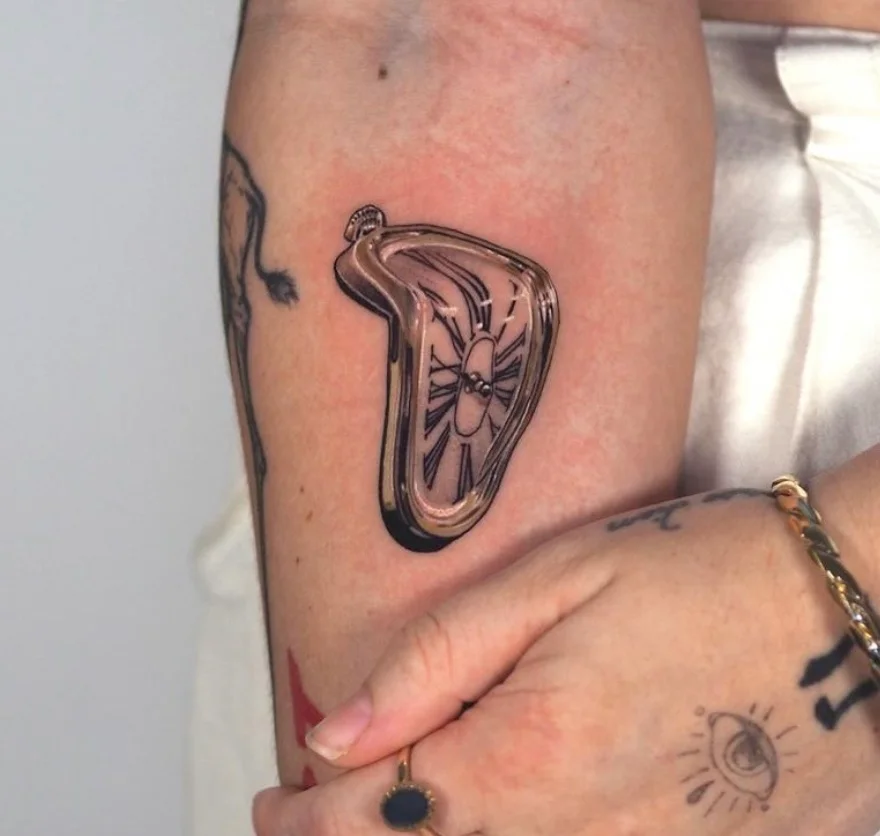 Salvador Dali inspired melting clock tattoo with surrealist elements by Karlo at Omnia Tattoo Melbourne