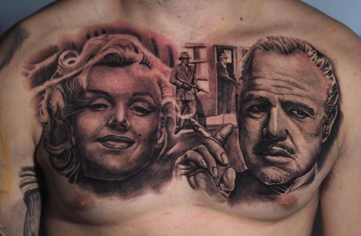 Chest tattoo with detailed black and grey work by Dylan James