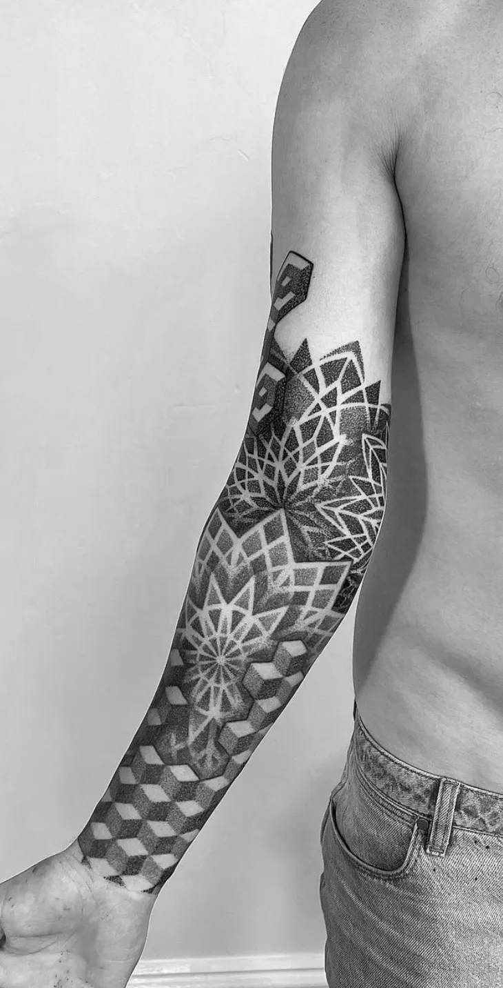 Detailed arm sleeve with mandalas and geometric patterns by Alex Berin