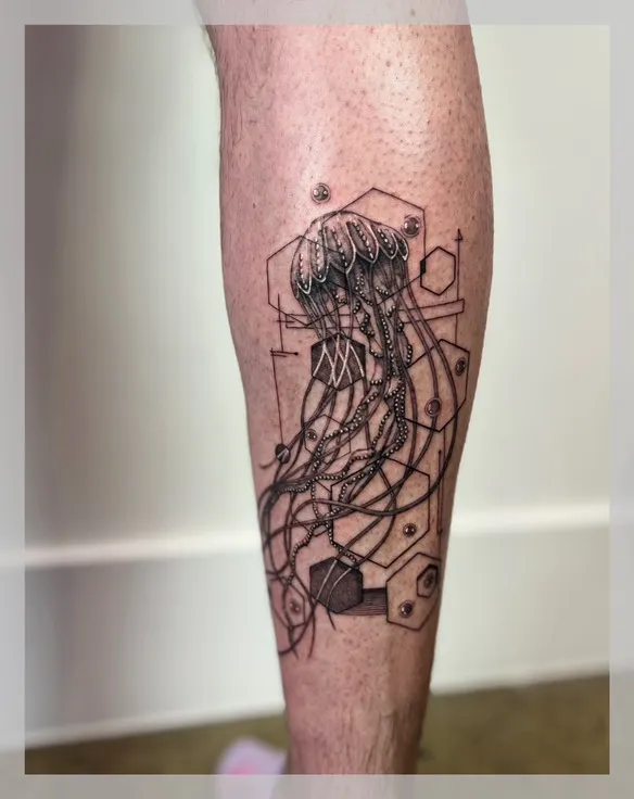 Calf tattoo featuring jellyfish design with geometric elements and hexagonal framework