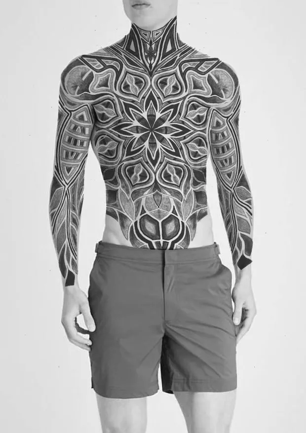 Chest tattoo with colored lilies framing geometric pattern from another angle