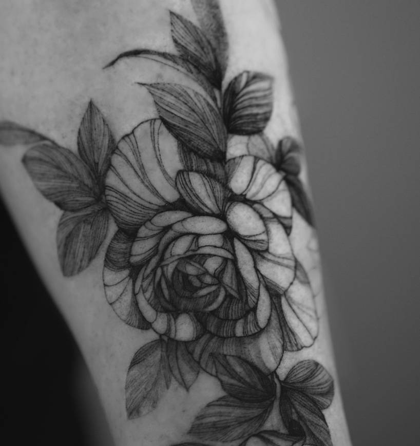 Detailed rose composition tattoo by Renei at Omnia Tattoo Melbourne